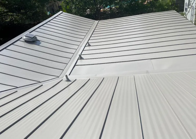 Solar attic fan installed on a metal roof for Roof Ventilation in Titusville